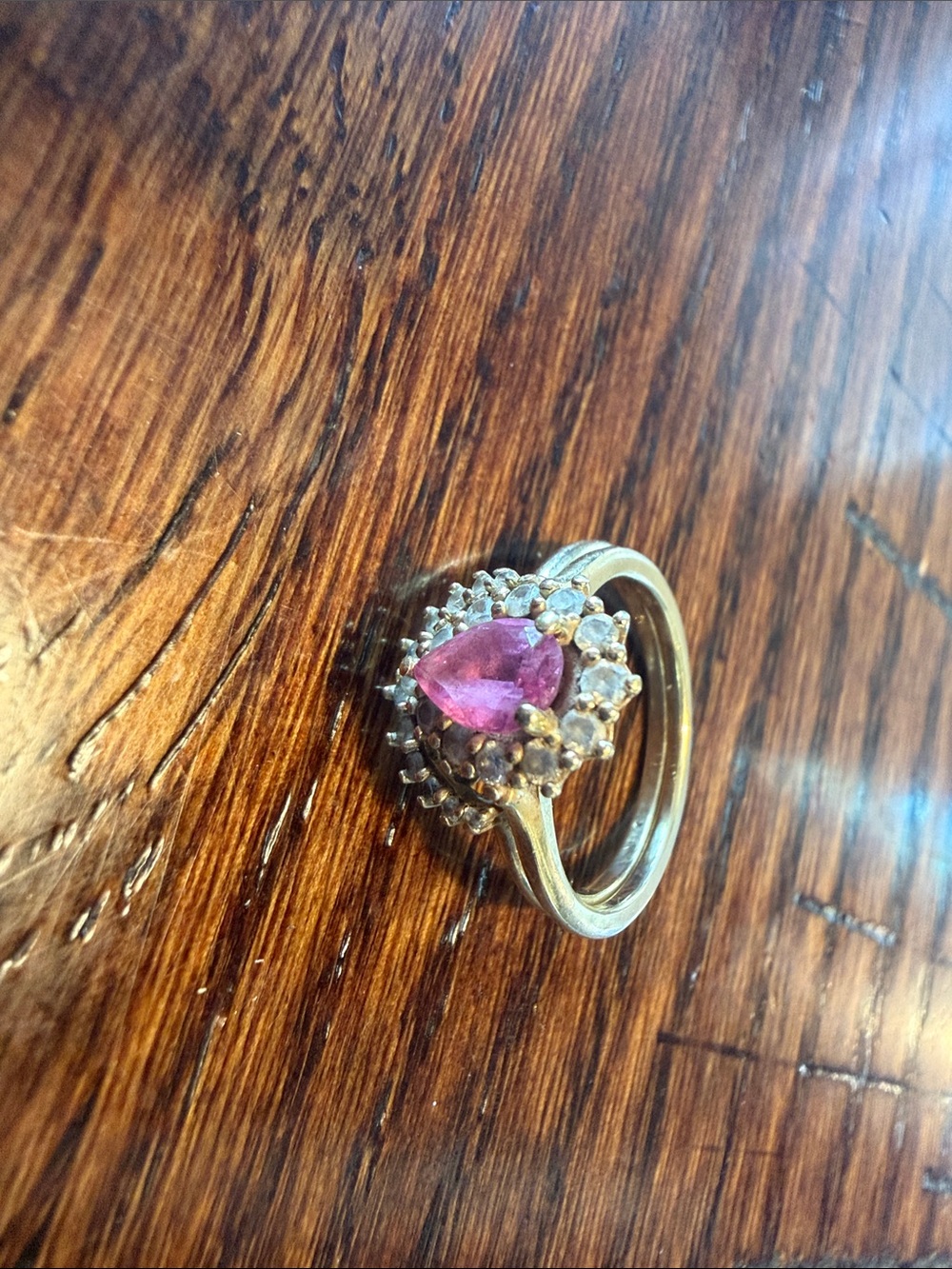 Gold Ring with Pink Teardrop Center and Halo Accents